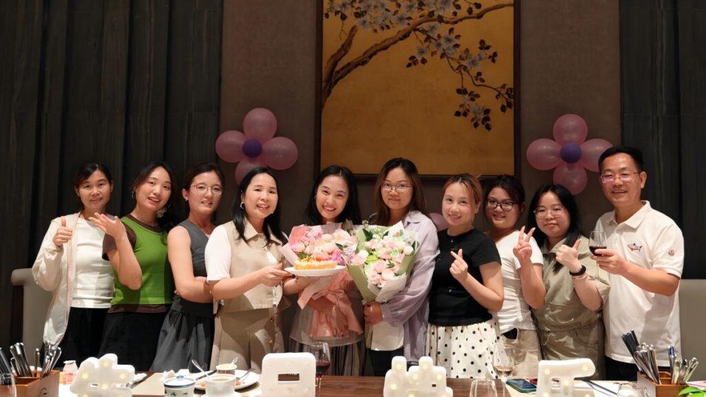 Mellume team members celebrating together during a company dinner